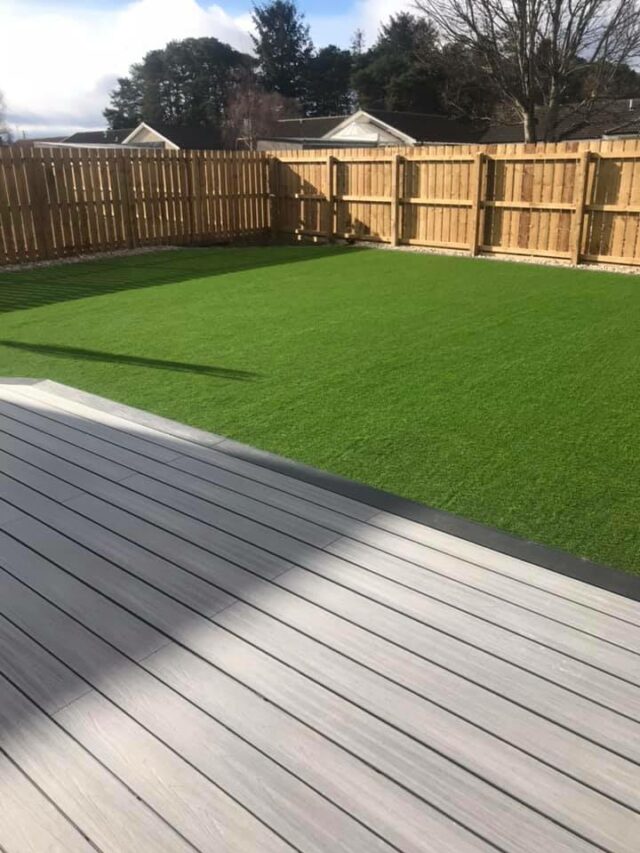 artificial grass back garden with decking in Sauchen